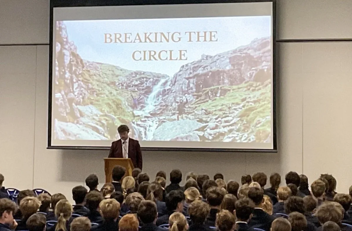 Brydon Duncan presenting Breaking The Circle to a full hall of students at a school assembly